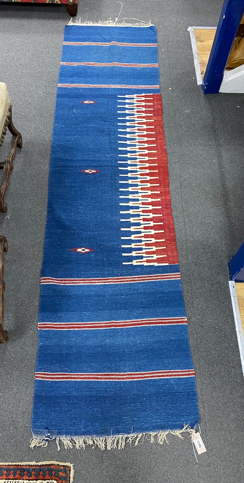A Middle-Eastern flat weave runner 268cm x 68cm.